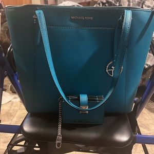 Micheal kors Turquoise set! Like new no stains,rips or tears! Too big for me